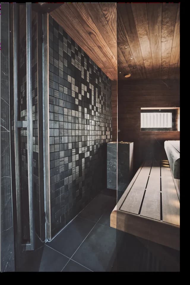 A sauna lined with mosaic-pattern panels