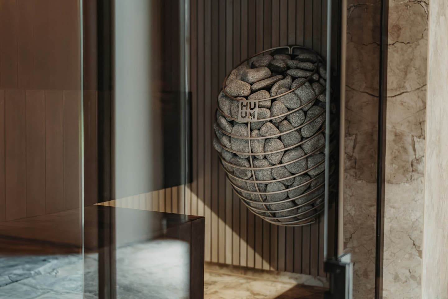 A sauna room with a HUUM Drop heater